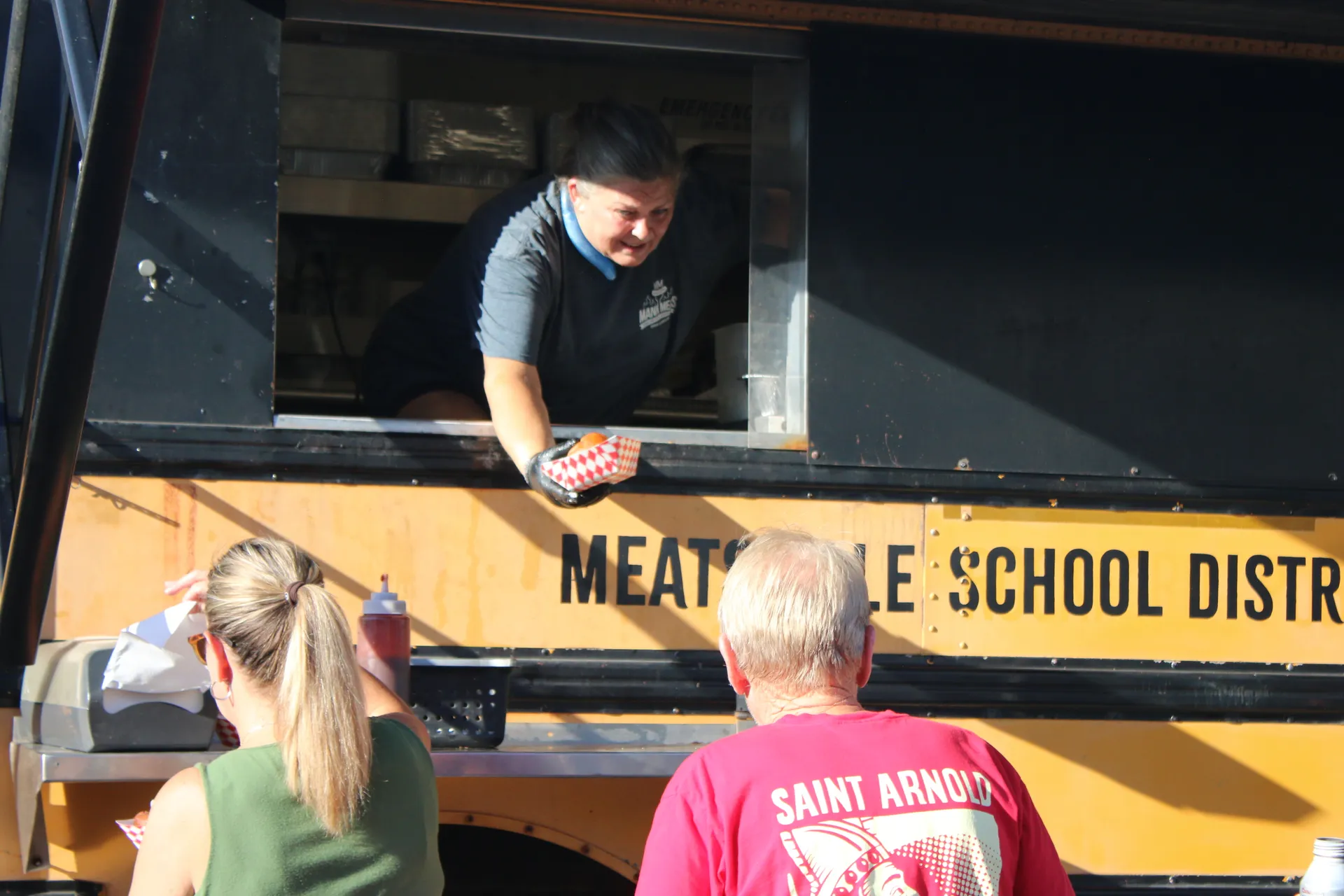 Mann Meats food truck serving attendees at the concert