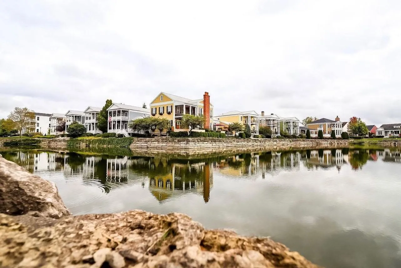 Homes reflected in one of the lakes at New Town in St. Charles, Missouri