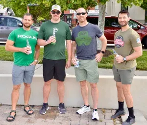 Irish Road Bowling participants gather along the course during the event