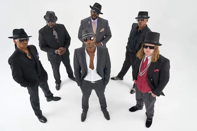 The members of St. Louis party band Just In Time in suits and hats