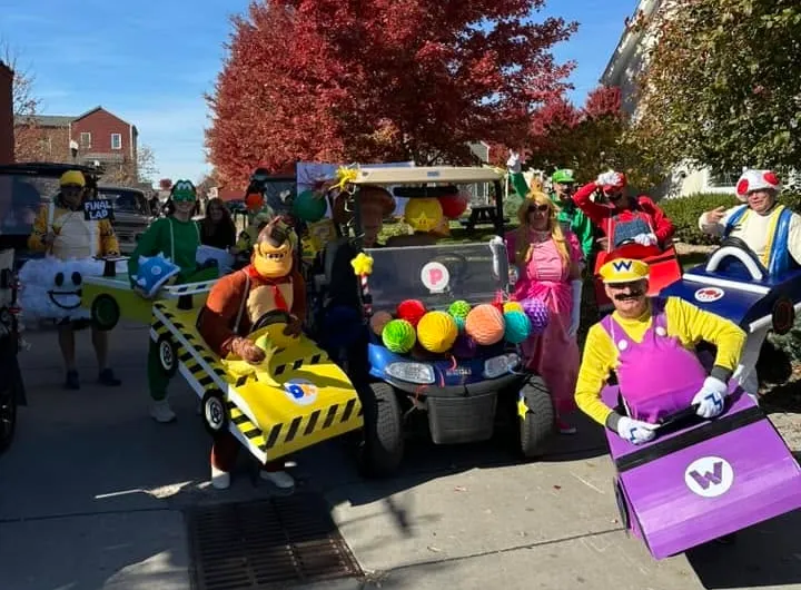 Mario Kart costumes and decorated carts ready for the New Town Halloween Vehicle Parade
