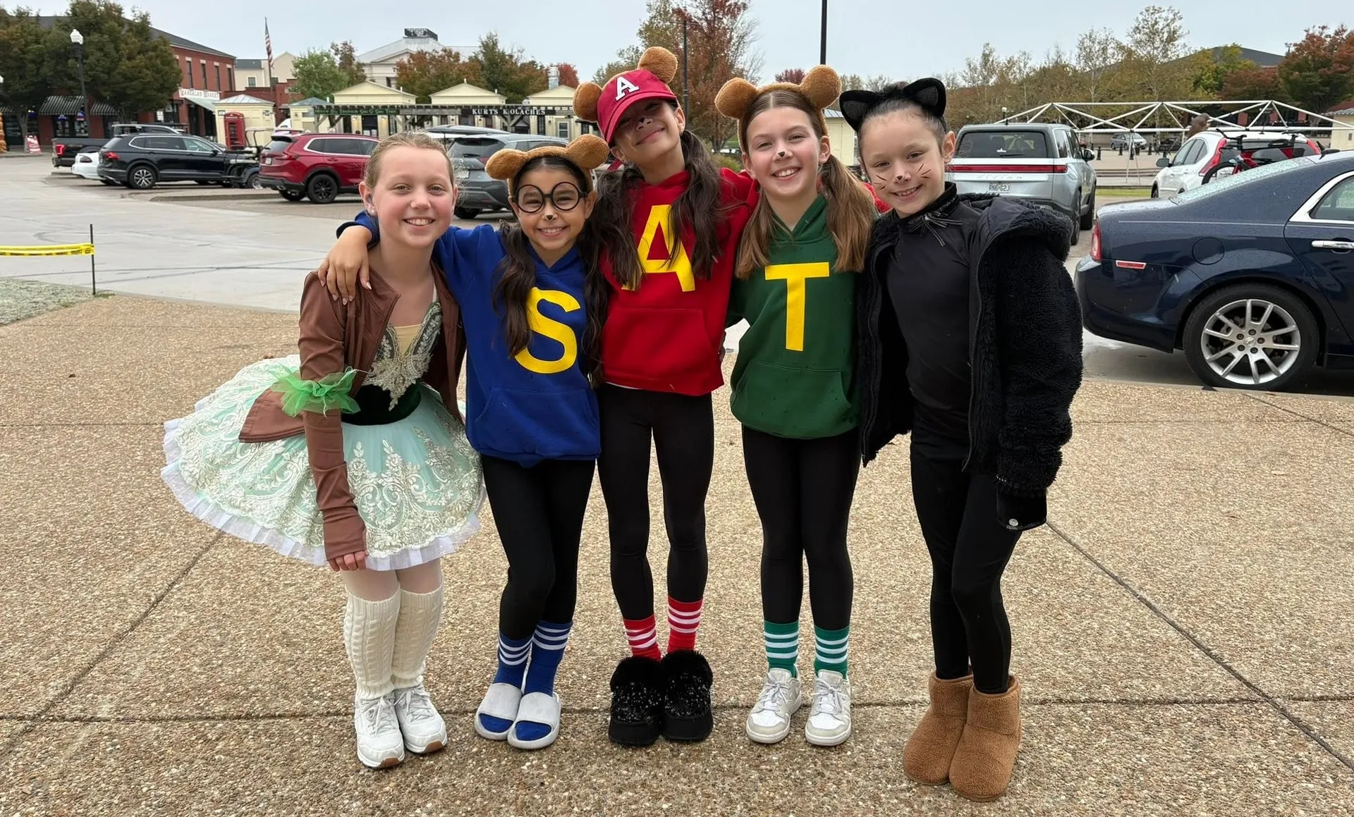 Kids in Chipmunks, ballerina and cat costumes at the Halloween celebration in New Town