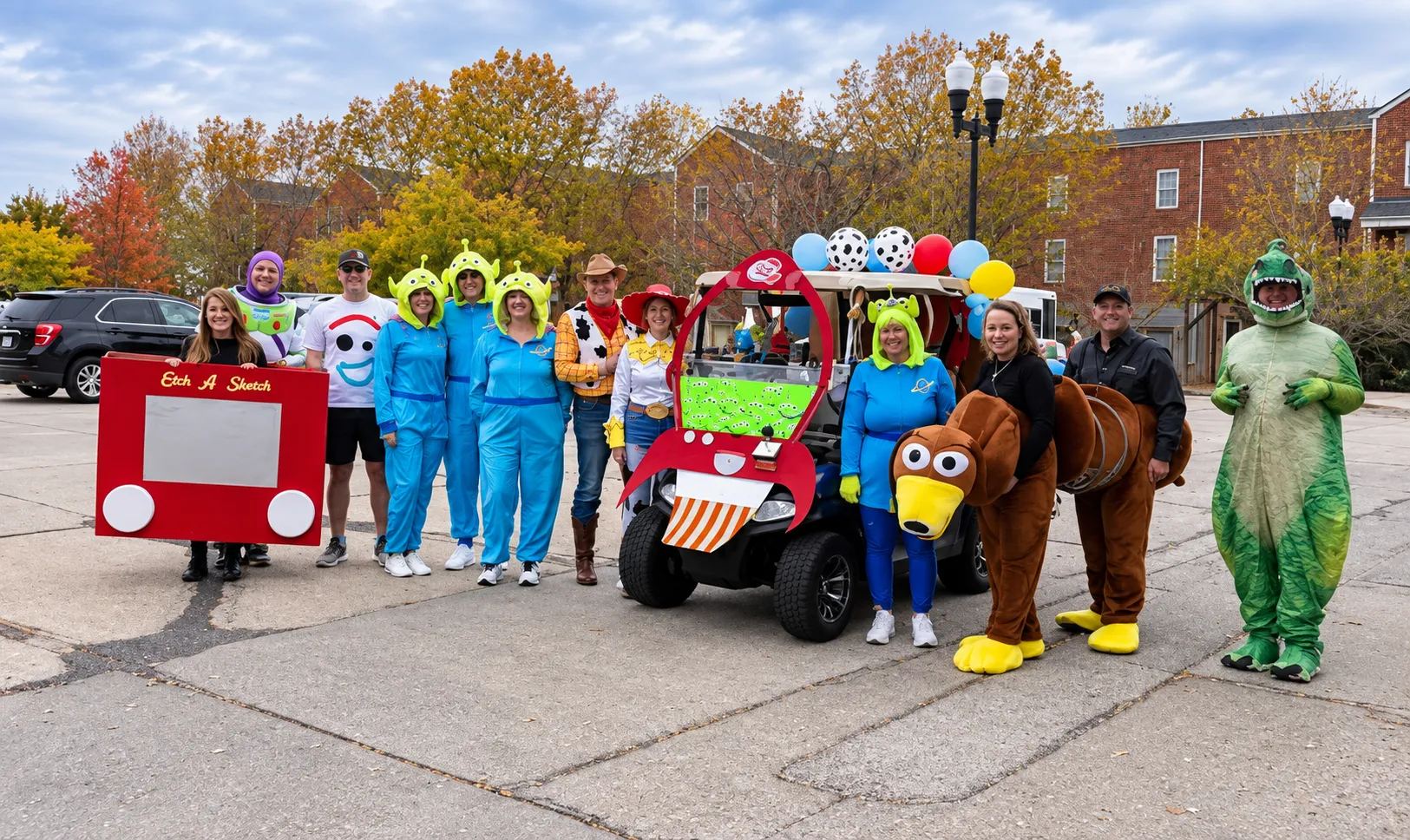 Toy Story-themed group with a decorated golf cart lined up for the Halloween Vehicle Parade in New Town