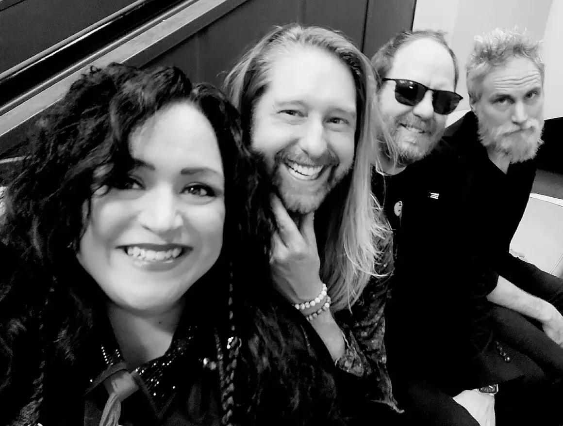 Black-and-white photo of the four members of Trixie Delight — Kelly Wild, Clint Wilson, Brian Zielie and Richie Lemoine
