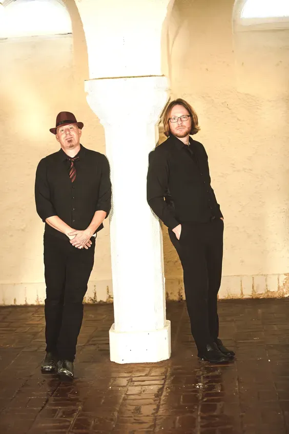 Hollywood Duo's Todd Sarvies and Dan Elder in black shirts posing for a promotional photo